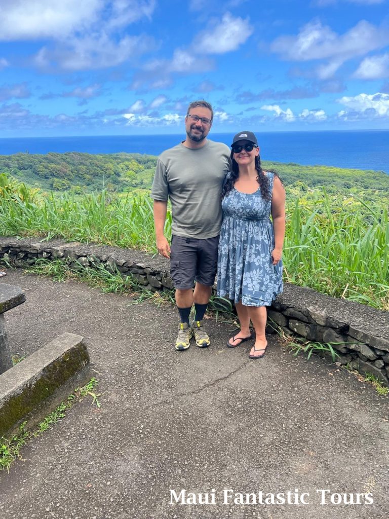 Couple posing at a scenic ocean overlook during a Maui Fantastic Tours sightseeing trip